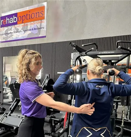 An exercise physiologist guiding a program