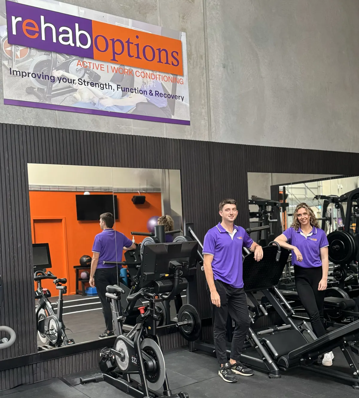 Two exercise physiologists in the branded gym
